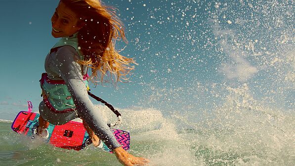 Kitesurfer doing darkslide at kitespot Dakhla Morocco - spectacular watersport trick